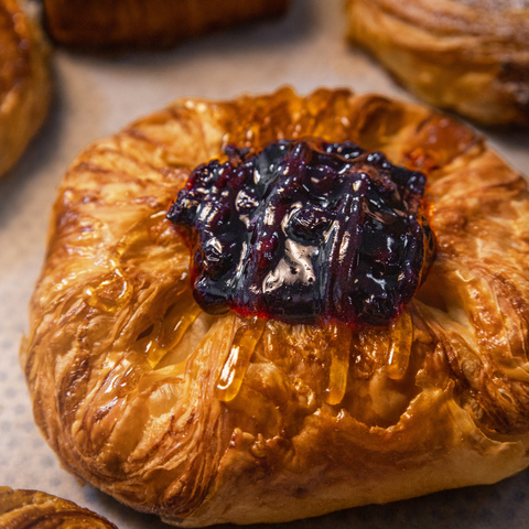 Blueberry Danish from Bake N More Factory is a golden, flaky pastry filled with rich, fruity blueberry compote